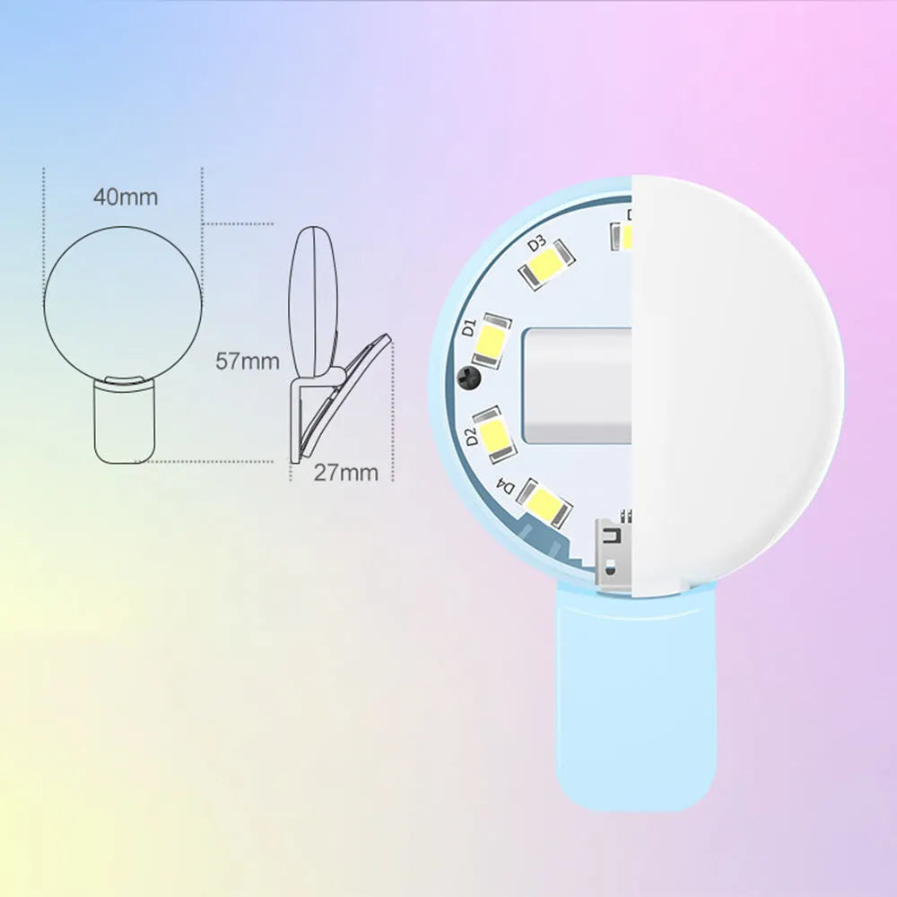 Mini round clip-on LED fill light attached to mobile phone for selfie photography