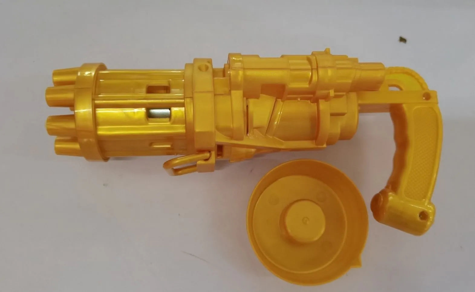Kids handheld bubble machine gun toy in pink, gold, or black colours with removable bubble head.