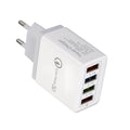 Dark blue 4-port USB wall charger with EU plug next to mobile phone
