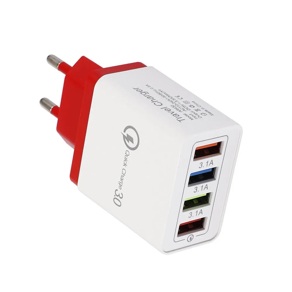 Dark blue 4-port USB wall charger with EU plug next to mobile phone