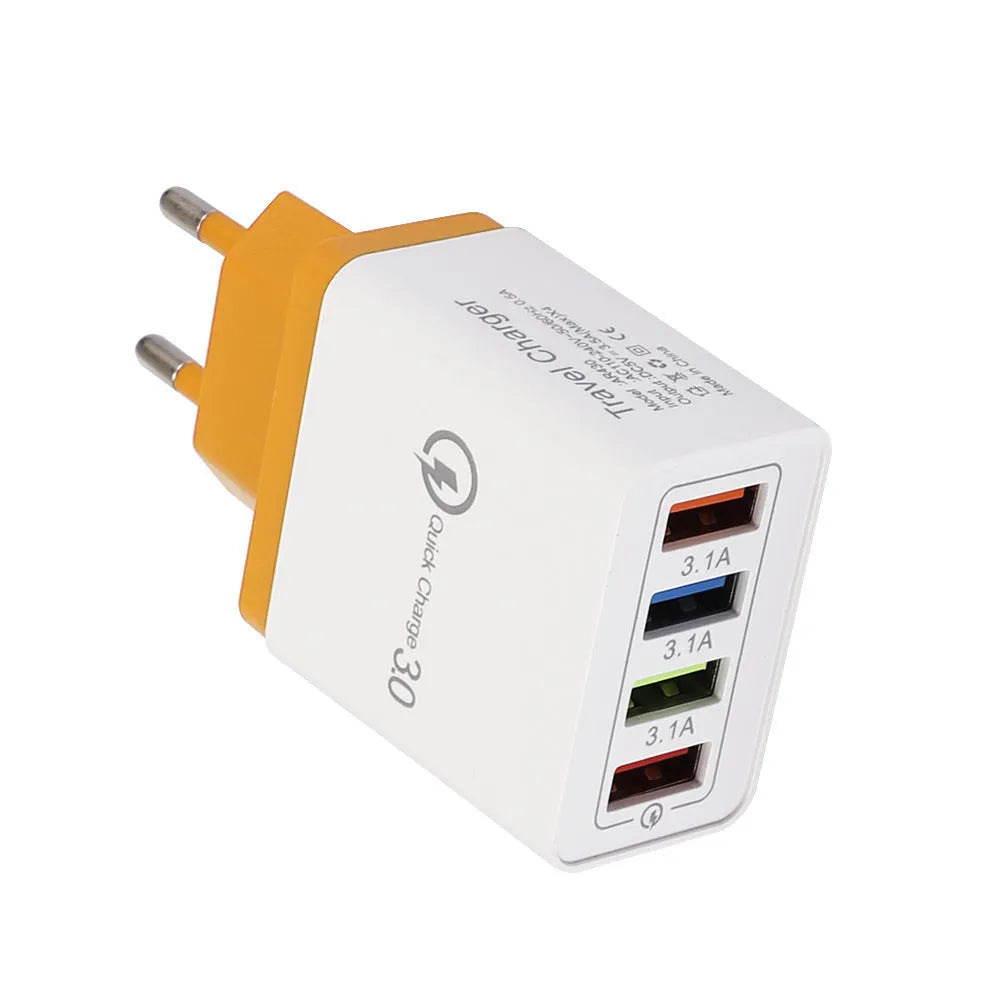 Dark blue 4-port USB wall charger with EU plug next to mobile phone