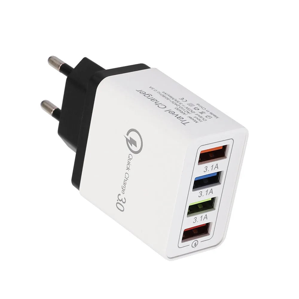 Dark blue 4-port USB wall charger with EU plug next to mobile phone