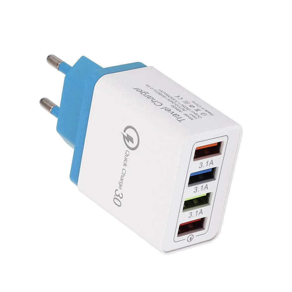 Dark blue 4-port USB wall charger with EU plug next to mobile phone