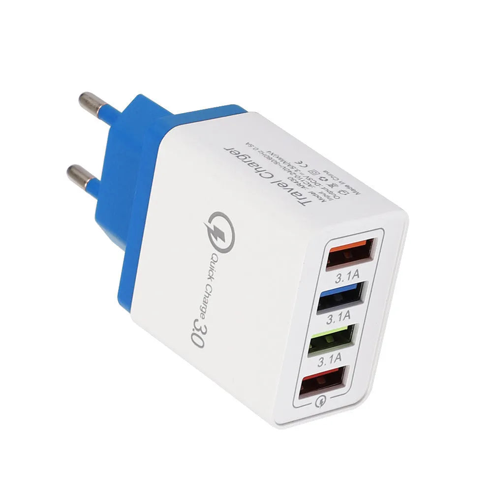 Dark blue 4-port USB wall charger with EU plug next to mobile phone