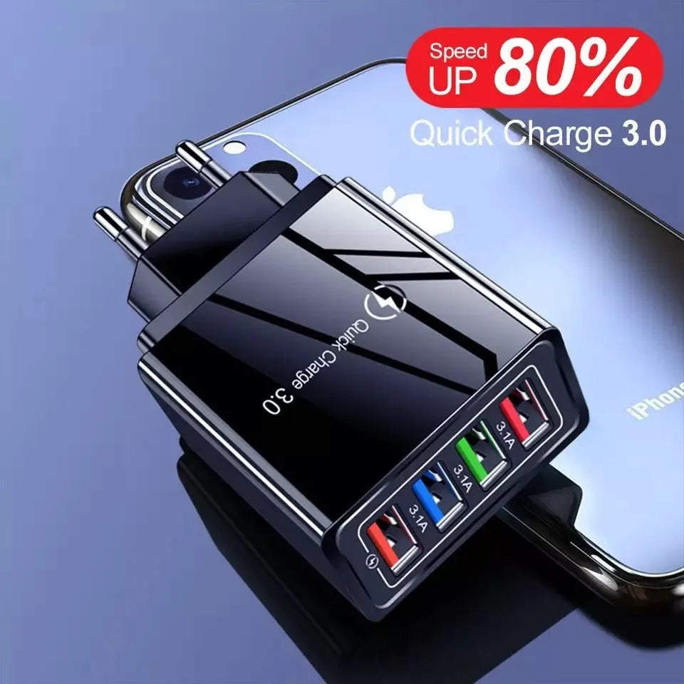 Dark blue 4-port USB wall charger with EU plug next to mobile phone