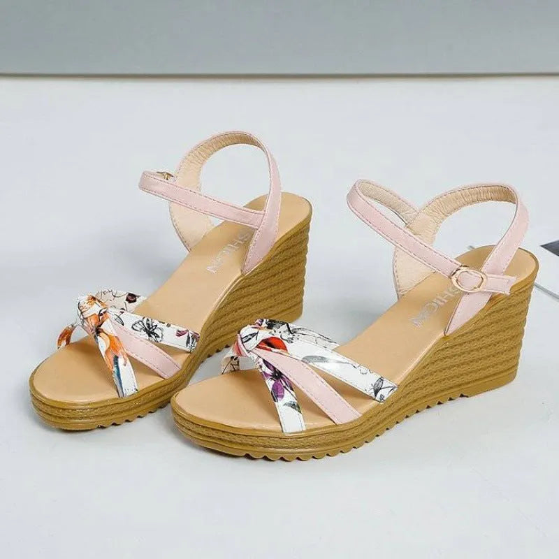 Women's pink wedge sandals with a buckle closure and thick non-slip heel