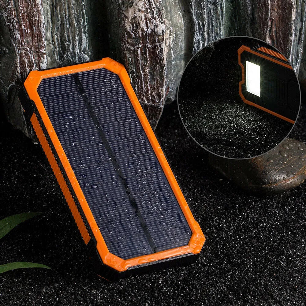 Orange solar power bank showing solar panel and USB ports, 20000mAh capacity.