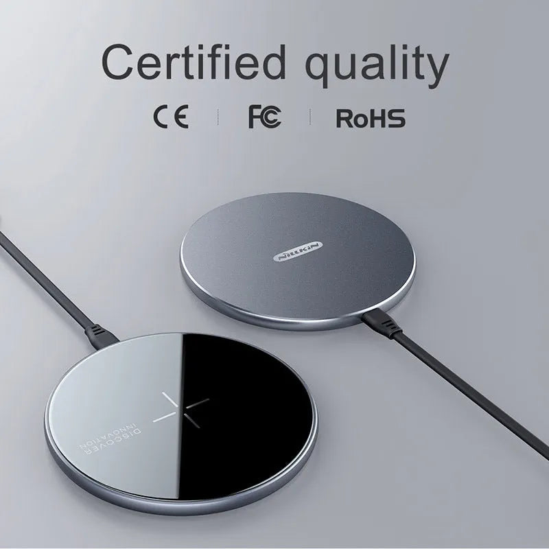 Black MagSlim magnetic wireless phone charger with foldable aluminium stand on a desk