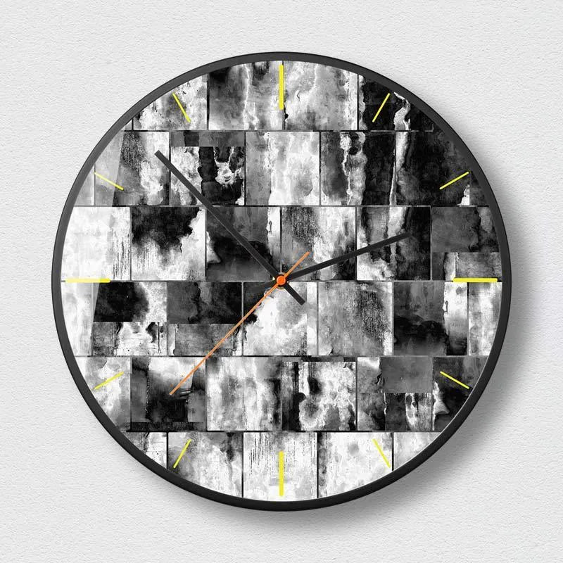 Round abstract art wall clock in black on a wall, showing one of six mysterious black design variants.