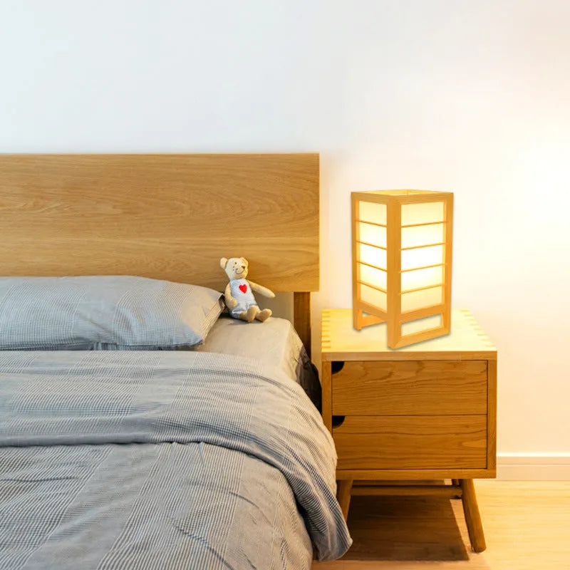 Solid bamboo wood Korean-style tatami bedside lamp on a table.