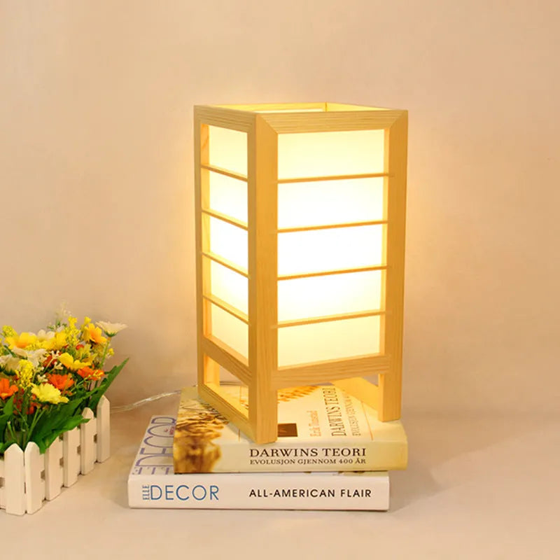 Solid bamboo wood Korean-style tatami bedside lamp on a table.