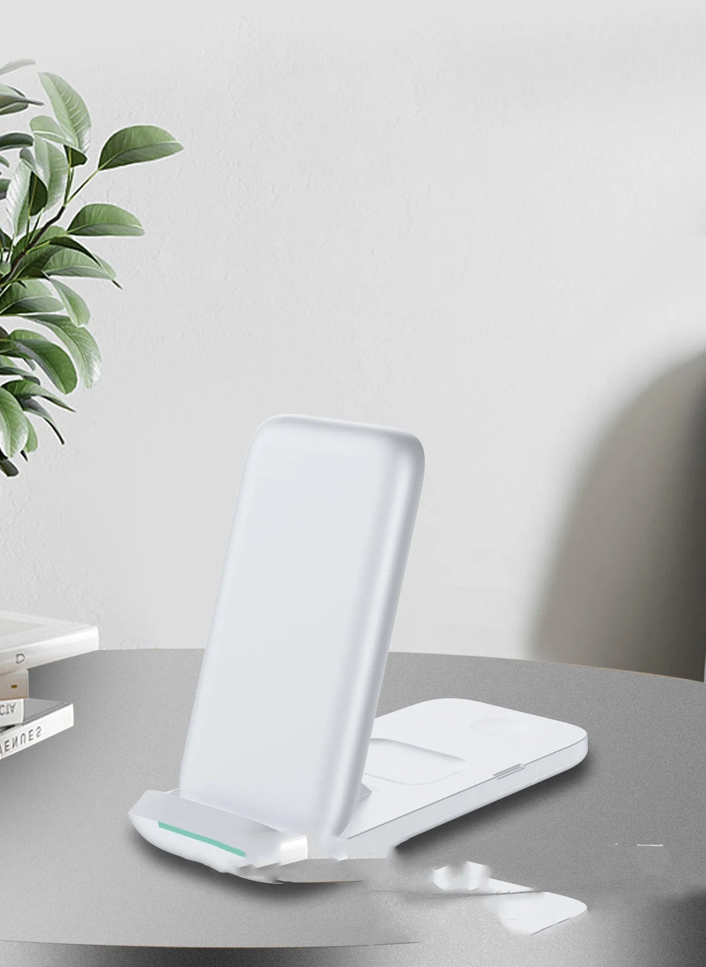 Black foldable three-in-one wireless charger showing both flat and angled positions
