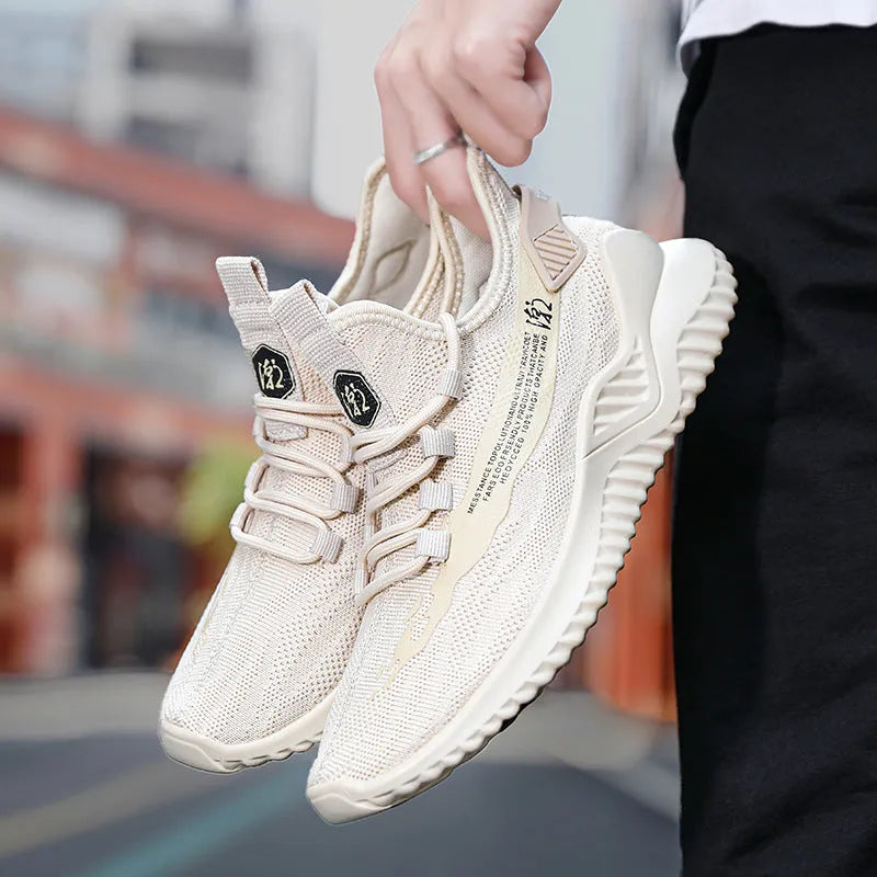Men's white low-top sports shoes with mesh uppers and rubber soles displayed from side angle