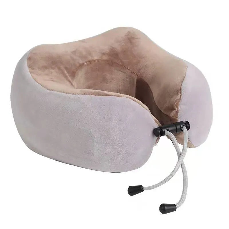 Brown U shaped electric neck massage pillow with heating function on wooden table