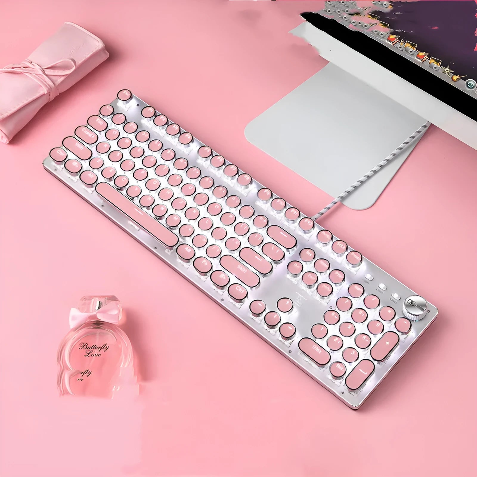 Queen Lipstick mechanical keyboard with silver base, pink keys, white backlighting, and green switches