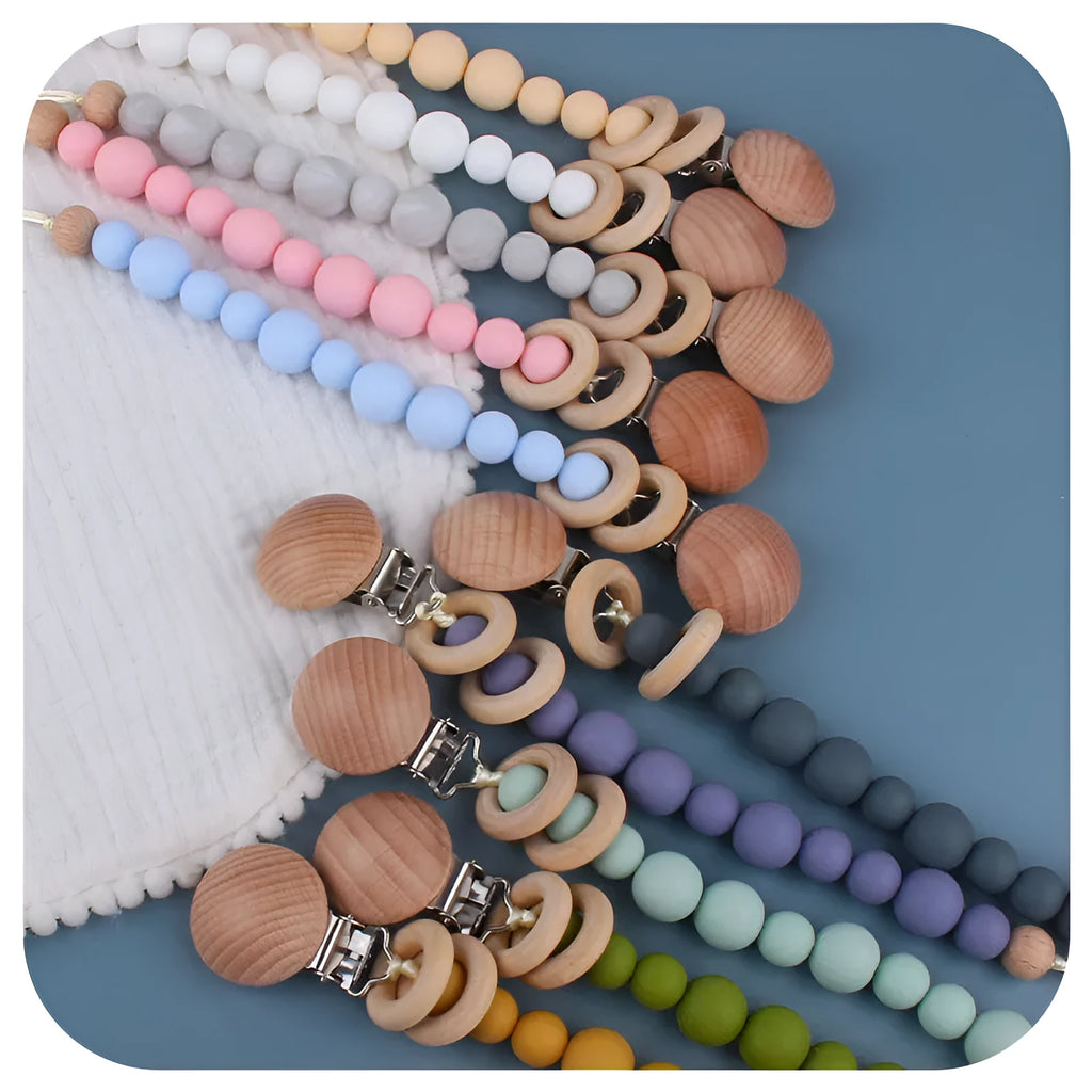 Avocado green beech wood and silicone baby pacifier chain on white background
