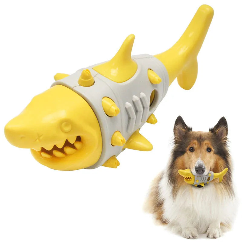 Blue, grey, and yellow shark-tooth shaped dog chew toy with textured surfaces and venting holes.