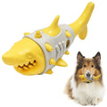 Blue, grey, and yellow shark-tooth shaped dog chew toy with textured surfaces and venting holes.