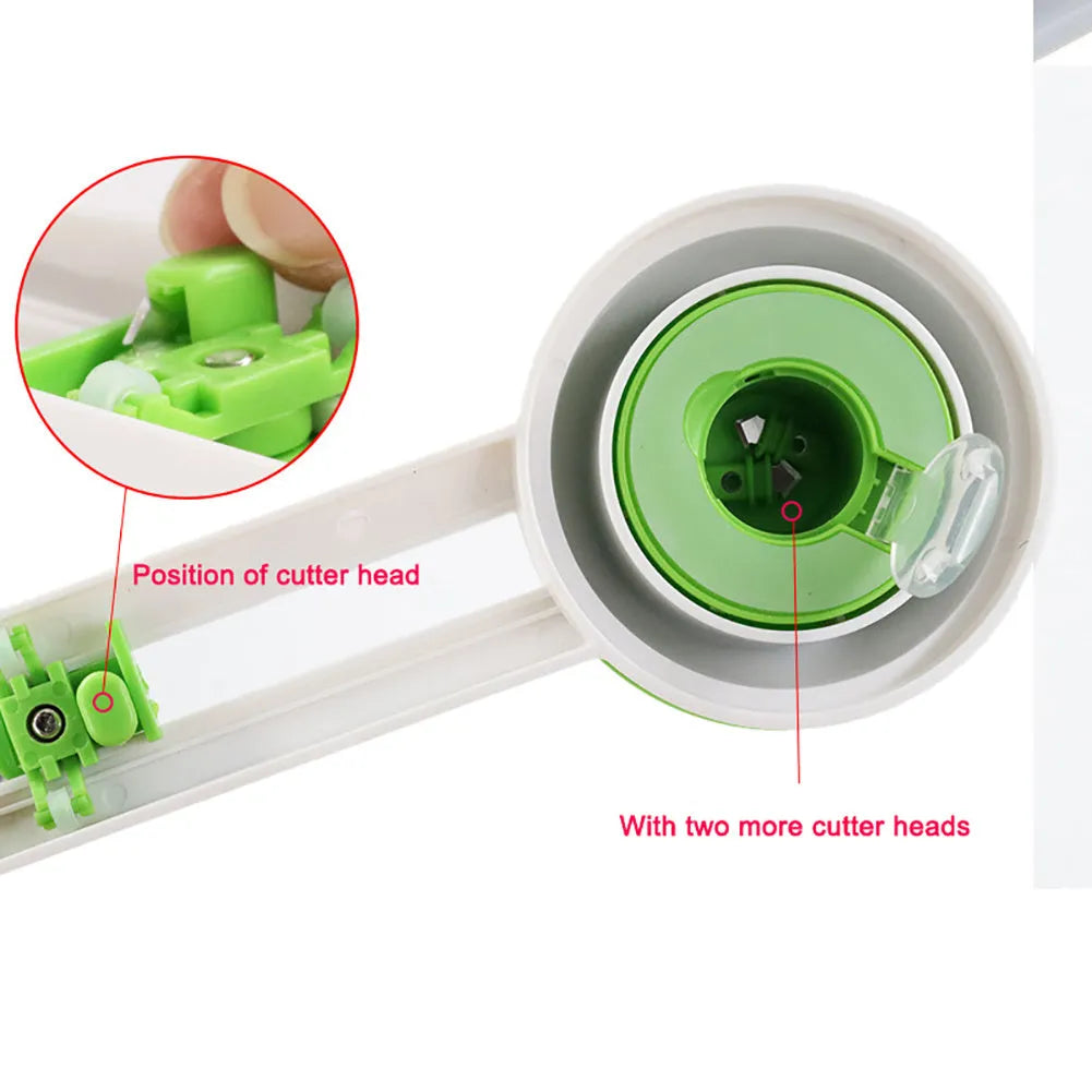 Green or orange plastic round paper cutter for A3 sheets on a colour box