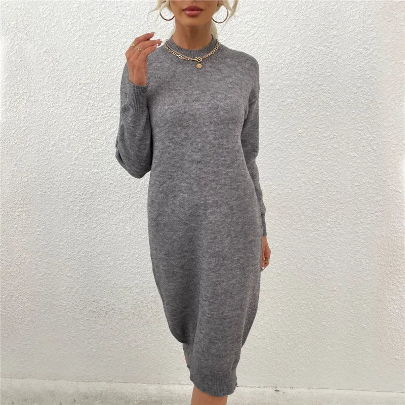Women's grey acrylic crew neck long sleeve pullover sweater on a hanger.
