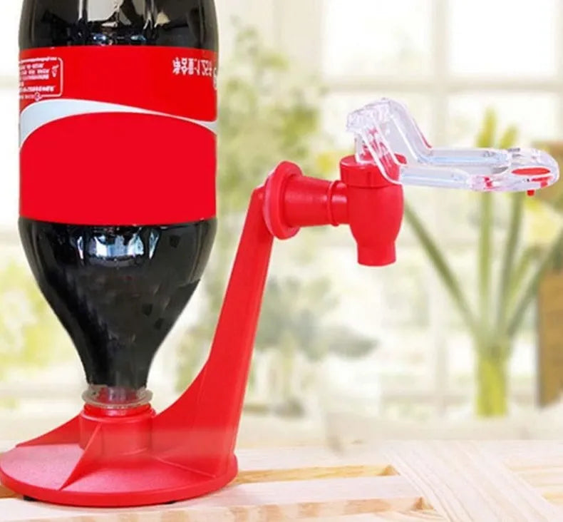 Red plastic Magic Tap soda dispenser attached to 2-litre bottle with push-button tap