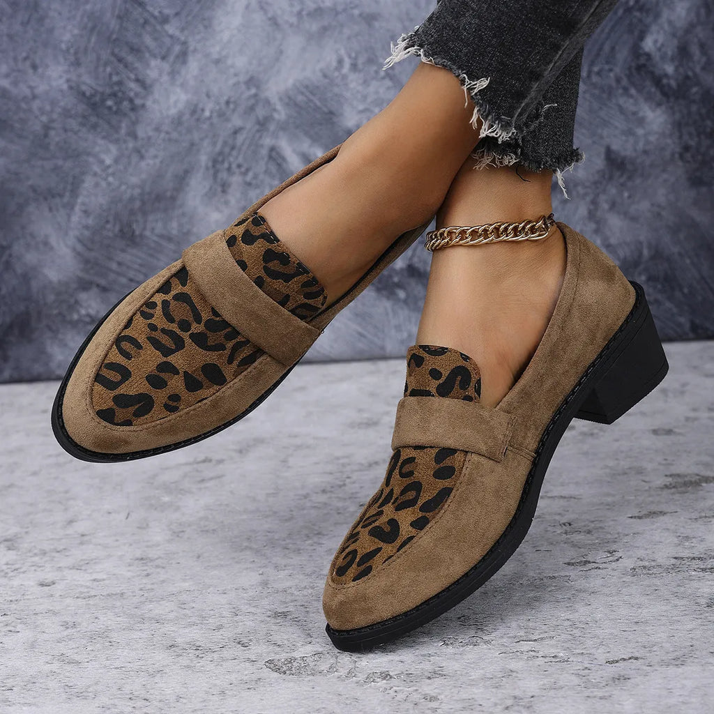 Leopard print suede slip-on pump with chunky heel in brown, shown from the side.