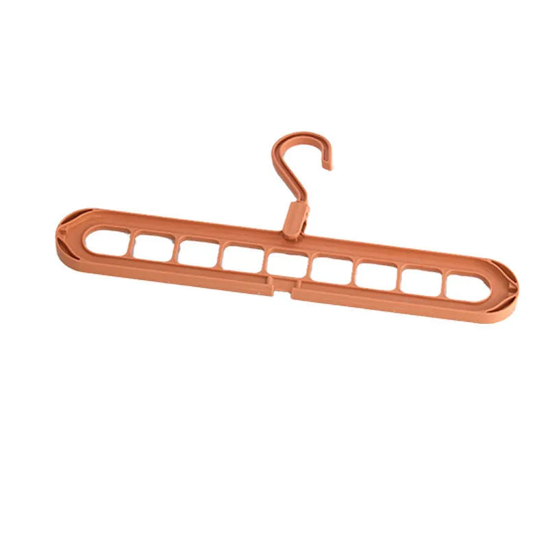 Green plastic nine-hole hanger folded flat showing multiple trouser hanging points