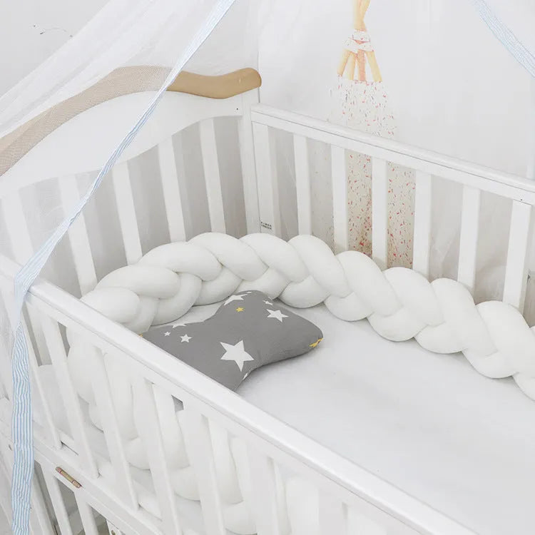 Braided knot crib bumper in spandex velvet, showing flexible length options for cot protection.