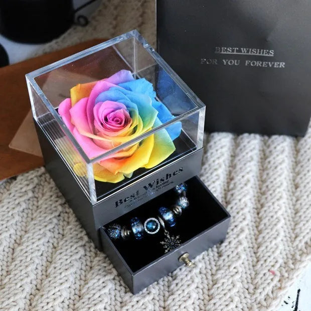 Eternal Flower gift box with preserved roses and carnations inside, measuring 8.5 cm square by 10.5 cm high