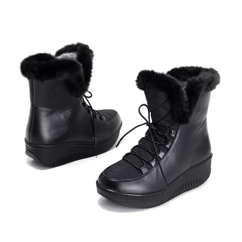 Women's black platform winter boots with lace-up front and water-resistant PU leather.