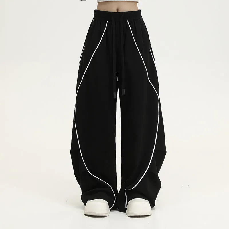 Black pleated wide-leg hip hop trousers with striped pattern and mid-waist design