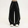 Black pleated wide-leg hip hop trousers with striped pattern and mid-waist design