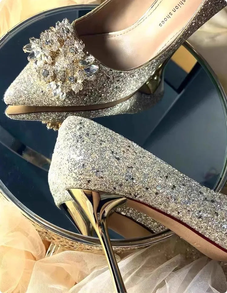 Champagne pointed toe wedding shoes with crystal rhinestone detail on a fine high heel.