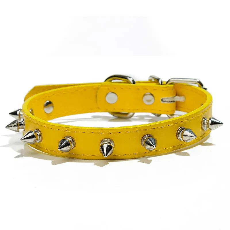 A spiked dog collar made of black PU leather with metal studs and an alloy metal buckle.