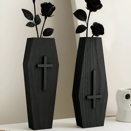 Black cross-shaped wooden wall shelf for home decoration, measuring 27 by 9 centimetres.