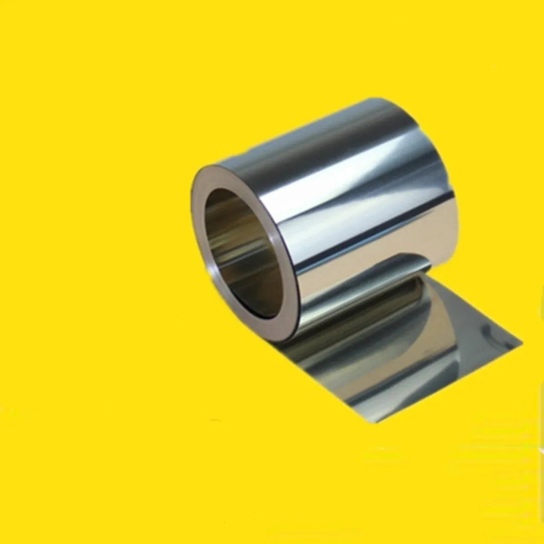 304 stainless steel metal shim strip on a workshop bench with a ruler showing its thin gauge.