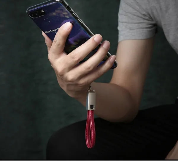 Short red leather and metal iPhone lightning charging cable showing 20cm length.