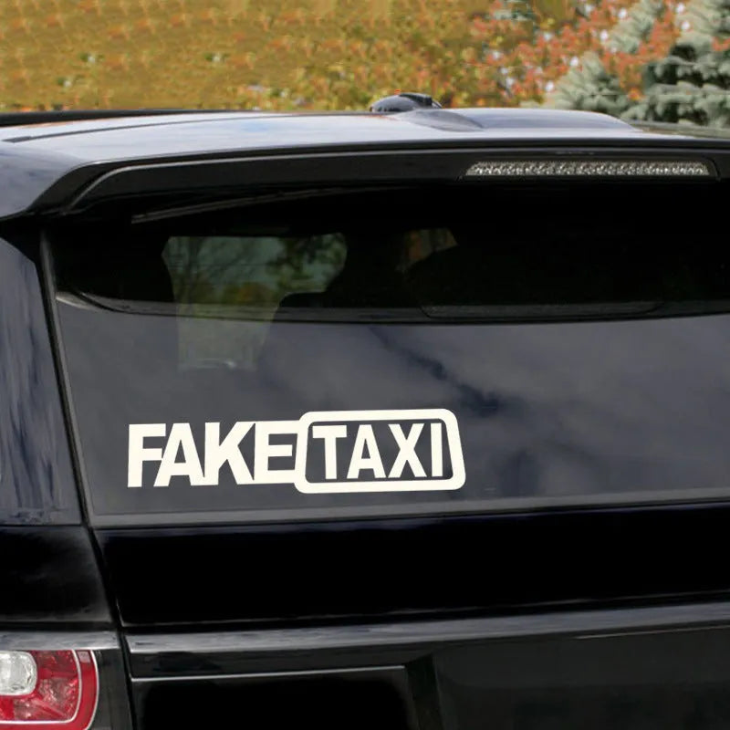 Set of three FAKE TAXI car warning stickers in yellow, black, and white, each 20cm by 8cm.
