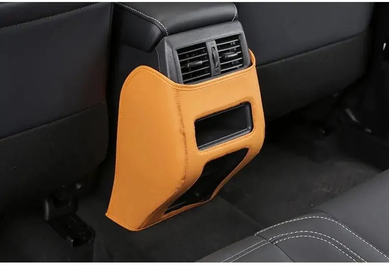 Set of three leather anti-kick pads for Outlander car seat armrest protection.