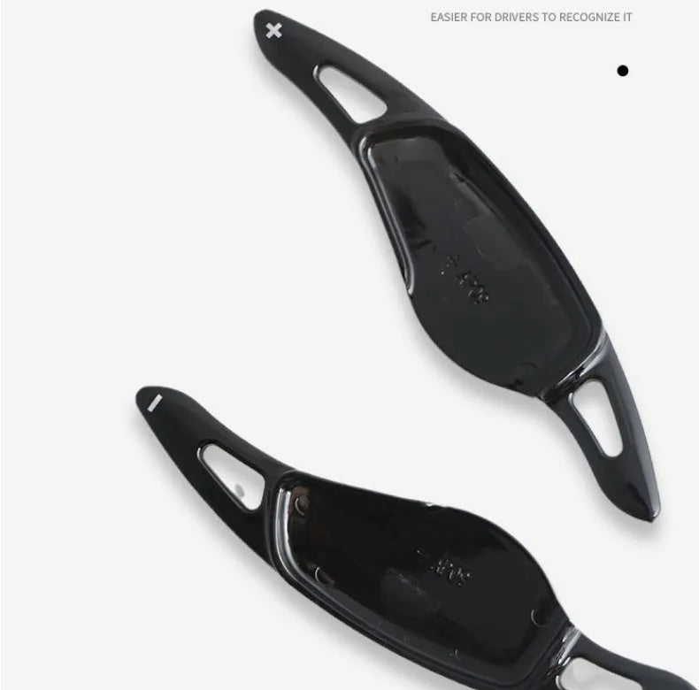 Steering wheel paddle shifter modification kit with carbon fibre pattern on black background