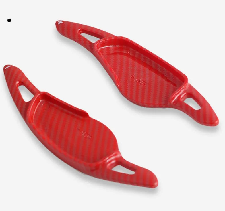 Steering wheel paddle shifter modification kit with carbon fibre pattern on black background
