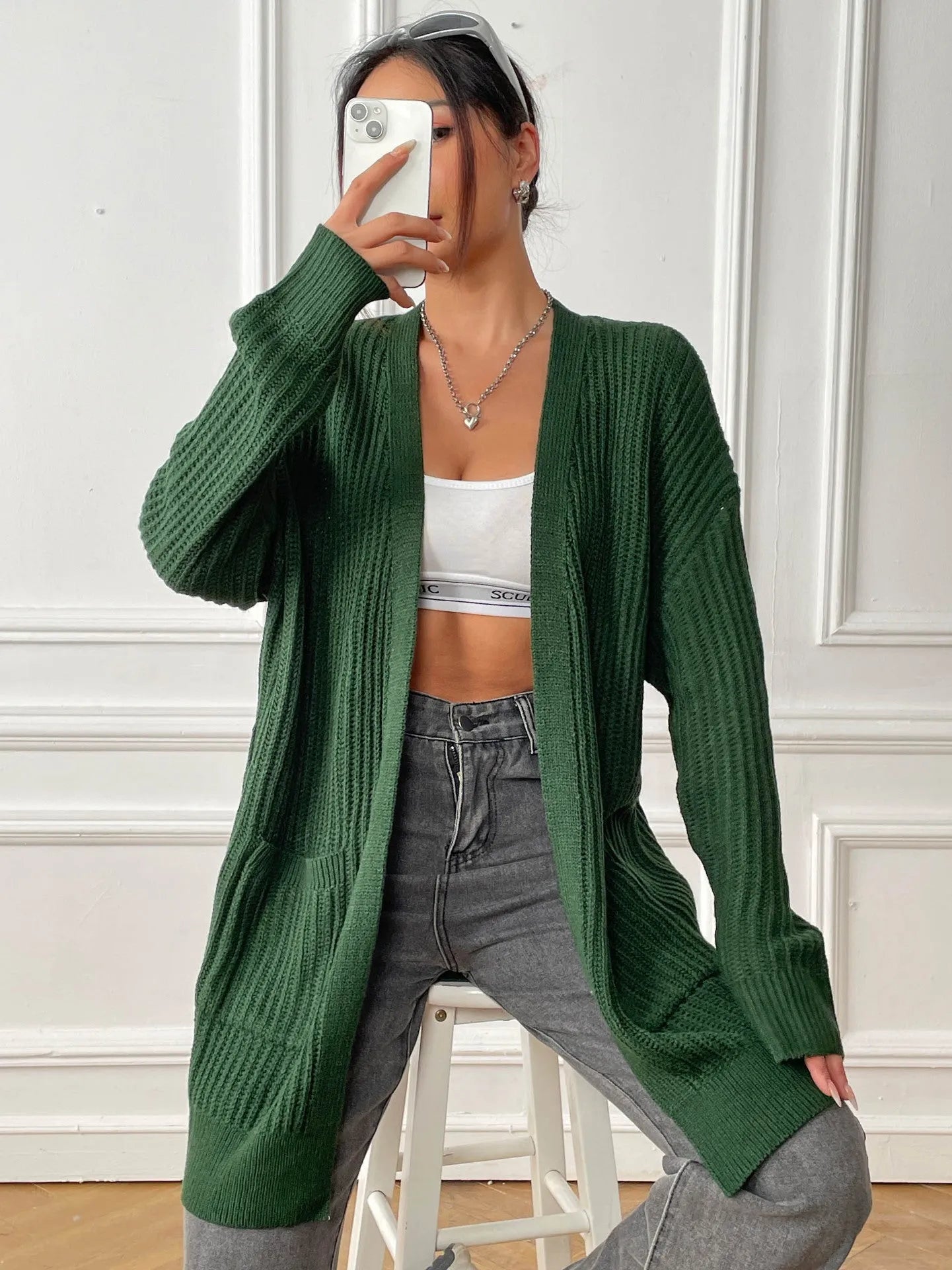 Women's mid-length loose fit cardigan with double pockets in dark green colour