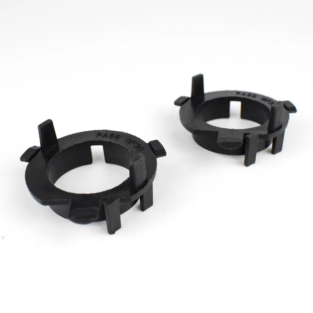 Black ABS plastic car headlight card holder for Nissan and Kia models showing compact size