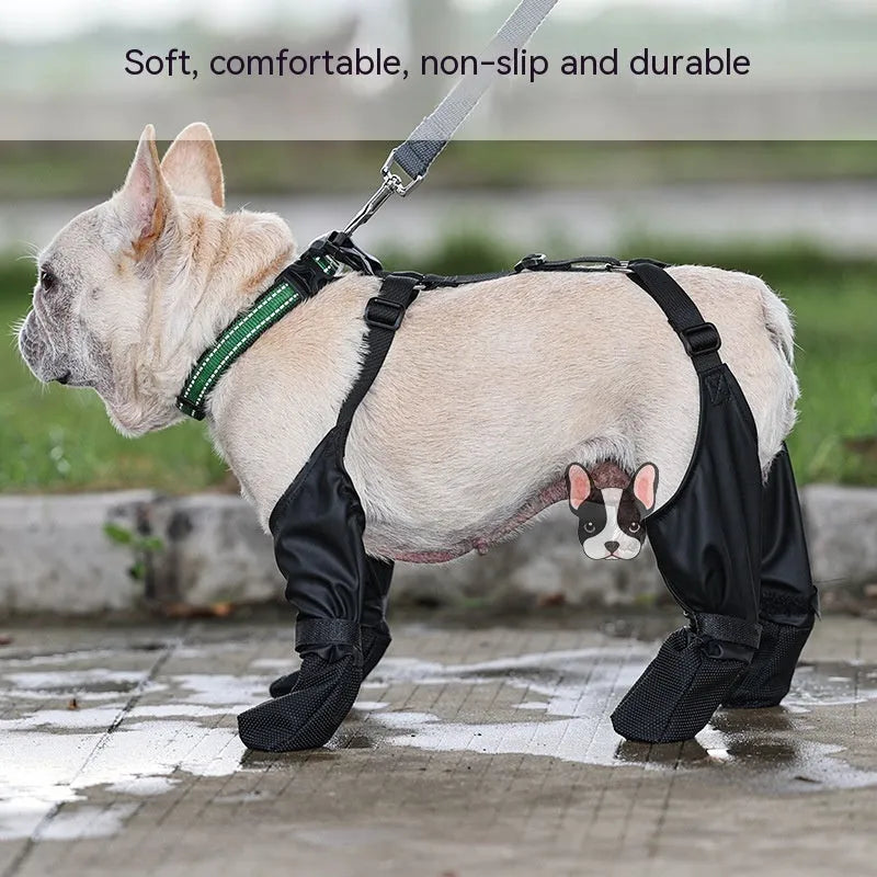 Black waterproof dog shoes with adjustable buckle and non-slip sole on surface