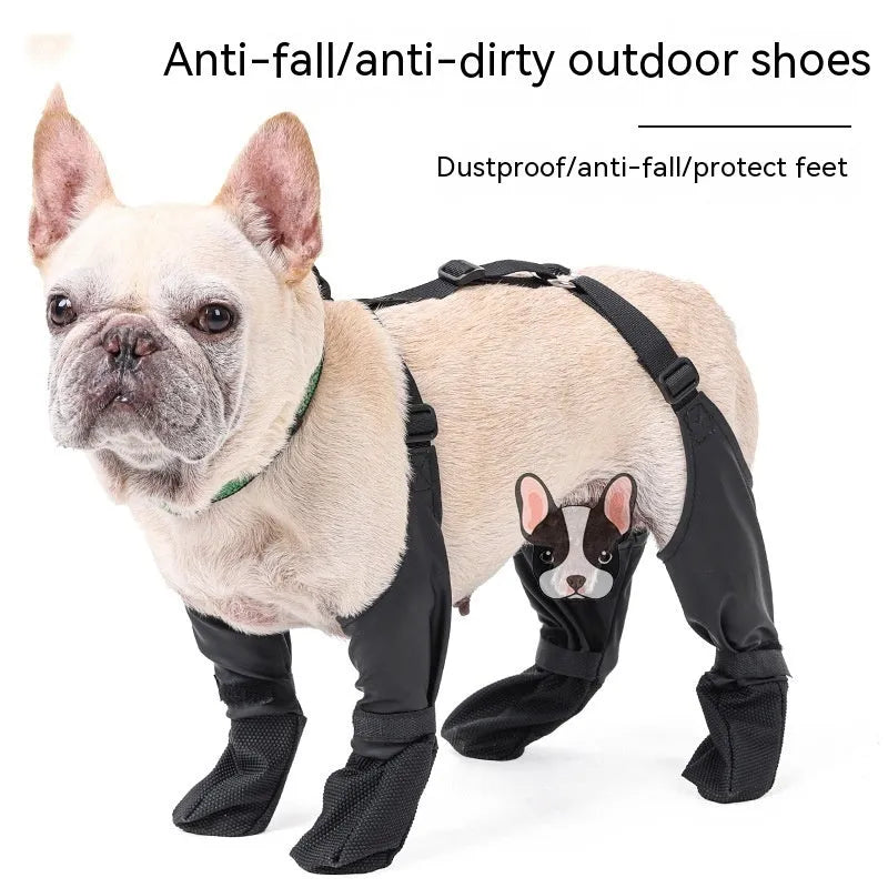 Black waterproof dog shoes with adjustable buckle and non-slip sole on surface