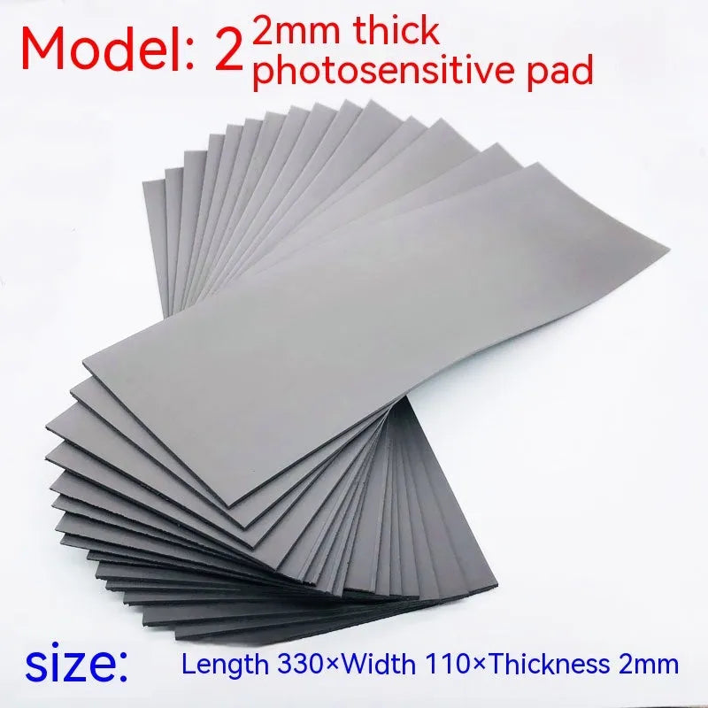 Black and grey light-sensitive seal mat for pottery and calligraphy projects showing 330mm x 110mm sheet