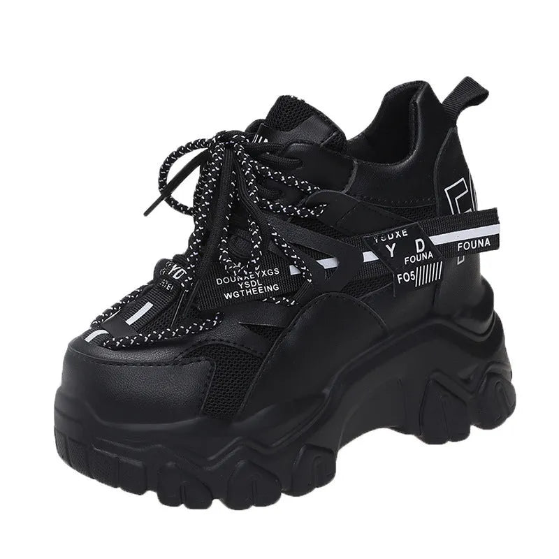White women's low-top platform sports shoes with breathable mesh, cross strap, and rubber sole.