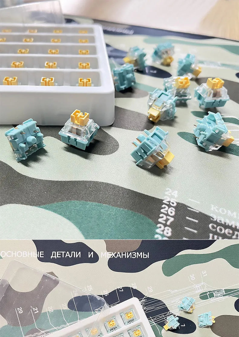 36 Sea Salt Lemon PRO Mute coloured mechanical keyboard switches laid out in rows.