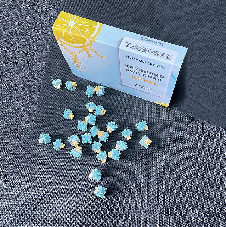 36 Sea Salt Lemon PRO Mute coloured mechanical keyboard switches laid out in rows.