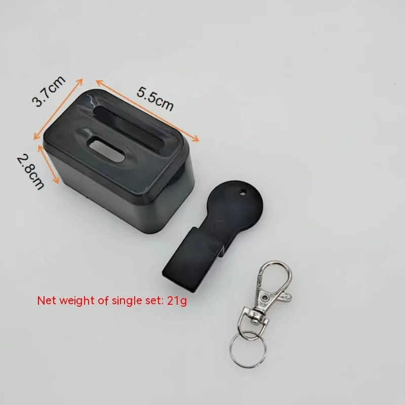 Black and red plastic seat belt buckle protective clamp holder device on a car seat.